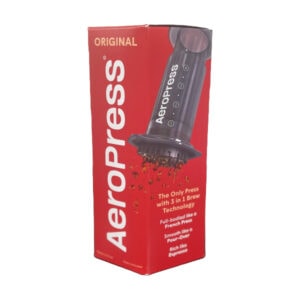 Badger & Dodo. Red Aeropress Starter Kit box displays the coffee maker in use, labeled “Original” with key features highlighted. Ideal for new Aeropress users.