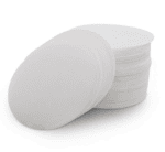 Badger & Dodo. A stack of AeroPress Filters lies on a white background, ready to help you brew your next perfect cup.