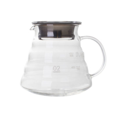 Badger and Dodo Coffee Roasters: The Hario V60 Range Server is made of clear glass with capacity markings, featuring a wide base, curved handle, and a stainless steel lid. Its modern minimalist design suits brewing and serving coffee or tea.