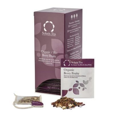 Badger and Dodo Coffee Roasters: A box of Solaris Tea labeled Organic Berry Fruity in purple and white is showcased, with a tea packet, sachet, and loose tea leaves filled with berries and herbs in front.