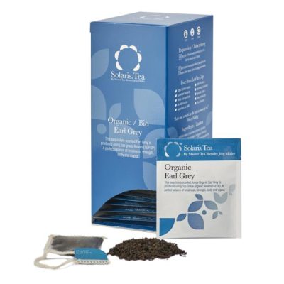 Badger and Dodo Coffee Roasters: The Organic Earl Grey tea box from Solaris features a top logo. On the front, you see a sachet and loose leaf pile beside a detail-displaying packet. The elegant packaging showcases calming blue and white shades.
