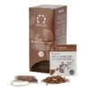 Badger and Dodo Coffee Roasters: A box of Organic Rooibos Cacao Chai is elegantly displayed with a teabag and loose rooibos leaves, while a labeled sachet is artfully placed in front.