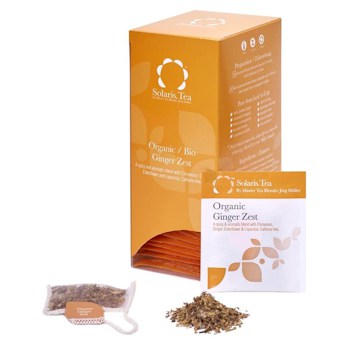 Badger and Dodo Coffee Roasters: An orange Solaris Tea box labeled Organic Ginger Zest displays a tea bag and loose leaves, accompanied by a smaller packet with matching organic branding and zestful details.