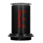 Badger & Dodo. A black AeroPress Go Travel Kit with red measurement numbers and a vertical logo, ideal for brewing coffee on the go or pairing with your compact AeroPress Go.