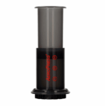 Badger & Dodo. The AeroPress Go Travel Kit is a black coffee maker with red measurement markings, shown on a white background—ideal for travel or as an addition to your coffee travel kit.