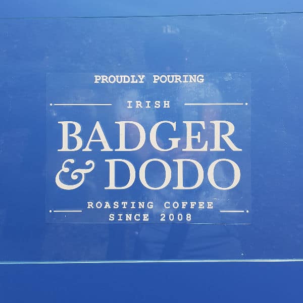 Badger and Dodo Coffee Roasters: A clear window decal on a blue backdrop displays the text: Proudly Pouring Irish Badger & Dodo Roasting Coffee Since 2008.