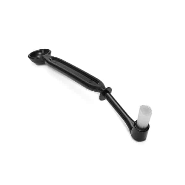 Badger and Dodo Coffee Roasters: An ergonomic black espresso brush with a long handle, featuring a small round brush at one end and a scoop on the other, perfect for coffee machine cleaning. Its design ensures efficient and easy maintenance of espresso machines.