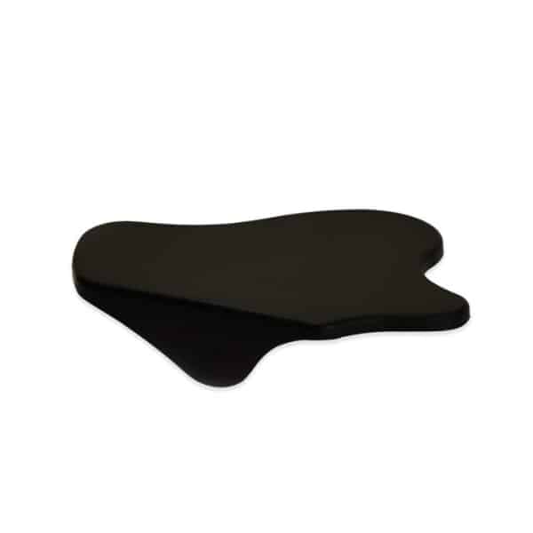 Badger and Dodo Coffee Roasters: Black, irregularly shaped ergonomic footrest with a smooth, slightly curved surface, designed to support feet.