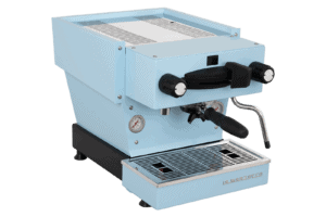 Badger & Dodo. The La Marzocco Linea Mini - Blue espresso machine features a portafilter, steam wand, gauges, and a drip tray, shown on a white background.