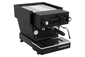 Badger & Dodo. The La Marzocco Linea Mini - Nera is a black espresso machine with silver accents and a steam wand, shown from the front-left angle.