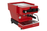 Badger & Dodo. A La Marzocco Linea Mini - Rossa stands out with its portafilter and steam wand against a crisp white background.