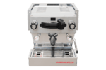 Badger & Dodo. Front view of a La Marzocco Linea Mini - Silver espresso machine, featuring dual gauges and a portafilter.