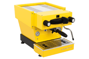 Badger & Dodo. The La Marzocco Linea Mini - Yellow espresso machine includes a steam wand, pressure gauge, and metal drip tray in a bright yellow finish.