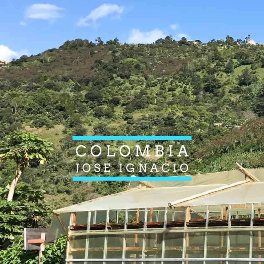 Badger and Dodo Coffee Roasters: A greenhouse with a transparent roof sits in front of a lush, green hillside under a clear blue sky. Text overlays read Colombia and Jose Ignacio.
