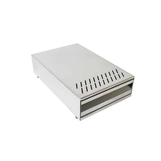 Badger and Dodo Coffee Roasters: A sleek rectangular Knock Box Drawer with stainless steel casing, featuring a front slot and vent holes on top, set against a white background.