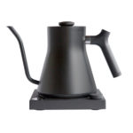 Badger & Dodo. The FELLOW STAGG EKG Electric Pouring Kettle in matte black features a wide base, curved gooseneck spout, and ergonomic handle for precise pouring and modern style.
