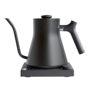 Badger & Dodo. The FELLOW STAGG EKG Electric Pouring Kettle in matte black features a wide base, curved gooseneck spout, and ergonomic handle for precise pouring and modern style.