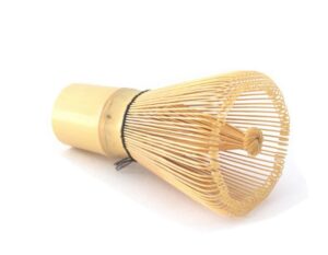 Badger & Dodo. The Matcha Whisk, made from bamboo, rests on its side against a white background.