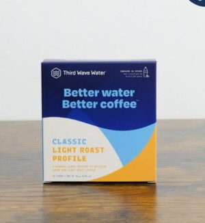 Box of Third Wave Water Classic Light Roast Profile mineral packets on a wooden surface, labeled “Better water, better coffee.”