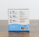 Back of Third Wave Water Classic Light Roast Profile box showing instructions to mix, shake, and brew, along with benefits, ingredients, and product details on a wooden surface.